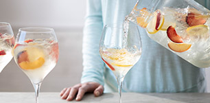 rosé in glasses on a table with fruit